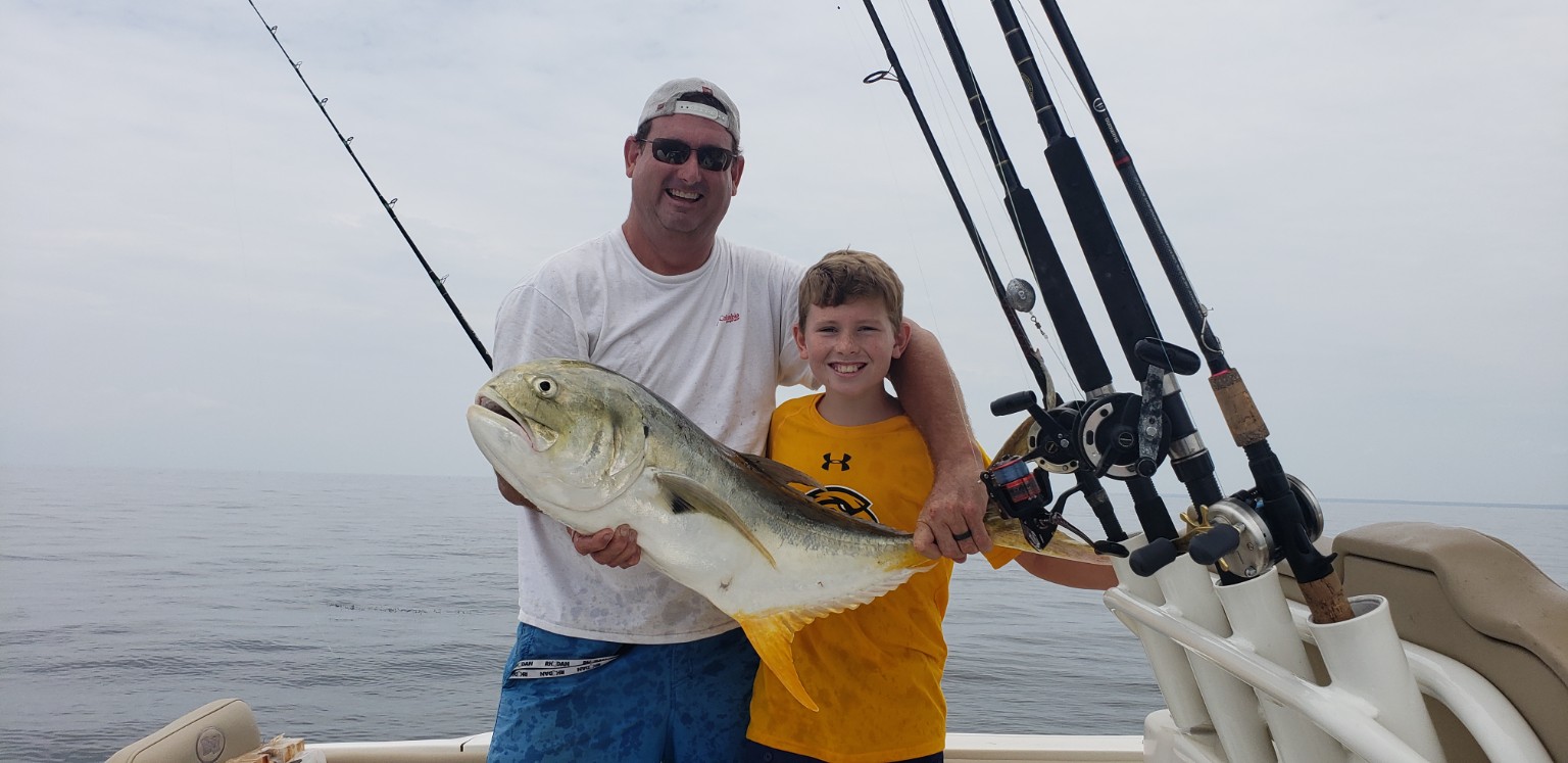 Family fishing together offshore