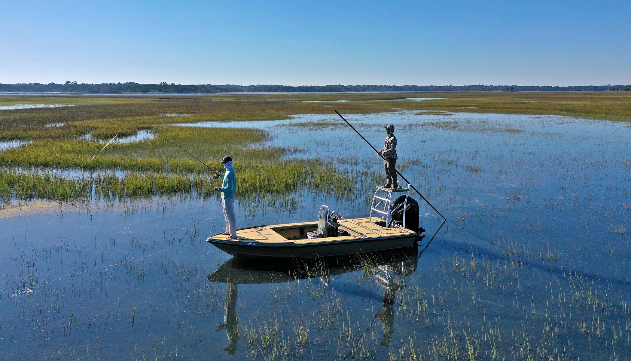 Action Craft 17 Flyfisher poling skiff in shallow water